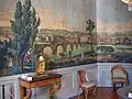 Salon aux boiseries peintes représentant la ville de Lyon.
