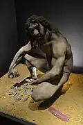 Illustration de la taille d'un biface par un Homo heidelbergensis