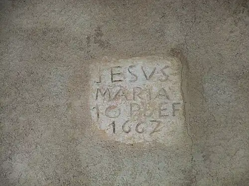 Pierre notant la date de la restauration de 1667.