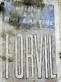 Publicité murale pour la brillantine Forvil.