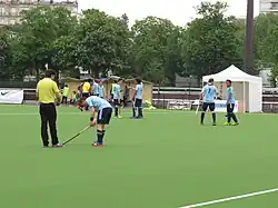 Des joueurs de hockey sur gazon