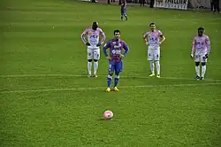 Joueur s'apprêtant à tirer un panalty.