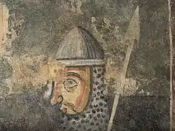 Scène avec un soldat avec le haume et la lance.