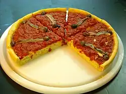 Piscialandrea des cuisines ligure et italienne, à la tomate et ail (variante).