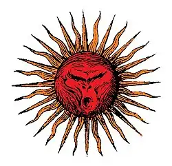 Dessin d'un soleil avec en son centre une tête de singe.