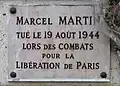 Plaque au no&nbsp;221, en hommage à Marcel Martin, tué pour la Libération de Paris (1944).