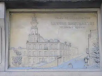 Plaque avec un dessin de la tour Montmartre.