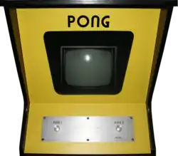 Photo d'une borne d'arcade jaune Pong.