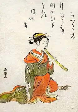 Courtisane jouant du shakuhachiLivre des Beautés (v. 1770)Musée Guimet
