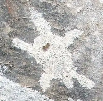 Forme animale stylisée dessinée avec un pigment blanc.