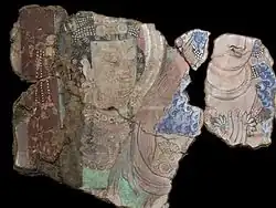 Couple richement paré. Scène de la prédication du Buddha. Kucha, Duldur-āqur. Xinjiang. Peinture murale, début du VIe&nbsp;siècle. Musée Guimet, Paris.