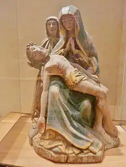 Vierge de pitié priant devant le corps du Christ, accompagnée de saint Jean l'Apôtre (bois peint, XVe&nbsp;siècle).