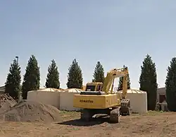 installation de cuves de récupération de l'eau de pluie.