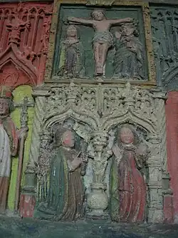 Retable de l'église (détail) : le calvaire et l'Annonciation.