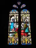 Vitrail : Vierge à l'Enfant et pénitents.