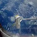 Le premier SPAS sur le Canadarm de Challenger durant la mission STS-7.