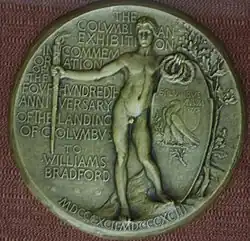 Médaille représentant un homme nu, le bras droit tendu avec une torche dans sa main et des couronnes de laurier dans sa main gauche.