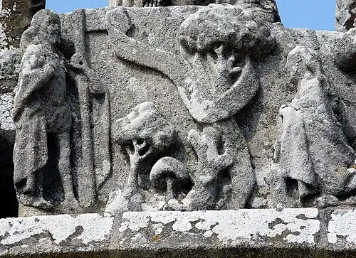 Le calvaire de Tronoën, le Christ et sainte Madeleine (Noli me tangere), face est, registre supérieur.