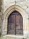 Porte XVIe&nbsp;siècle entrée par le bas-côté nord.