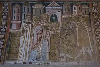 Fresques des Épisodes de la Vie du Pape Sylvestre (314-335). Scène 5 : Sylvestre, de retour à Rome, montre à Constantin les portraits de Pierre et Paul, afin qu'il puisse identifier les saints l'ayant visité dans son rêve.