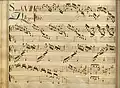 partition manuscrite rehaussée de couleurs, titre rouge et bleu