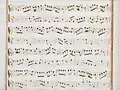 partition manuscrite rehaussée de couleurs passées rouge et bleu en bordures