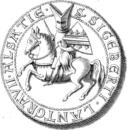Dessin d'un homme à cheval avec un heaume et un bouclier, le tout entouré d'une inscription en latin : Lantgravii Alsatie S Siegeberti