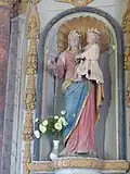 Sculpture en bois (Vierge à l'Enfant) intégrée dans le retable.