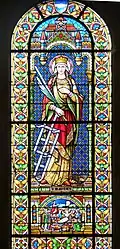 Vitrail de l'église représentant la jeune martyre.