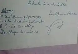 Signature de Paul-Bernard Kemayou, 12ème Roi de Bangou, homme politique et résistant anticolonialiste camerounais, alors en service aux Archives Nationales de la République de Guinée.