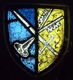 Un vitrail montrant le blason de l'abbaye.