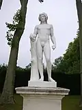 Louis-Aimé Lejeune et René Grégoire, Bacchus appuyé sur un tronc d'arbre et tenant une grappe de raisin.