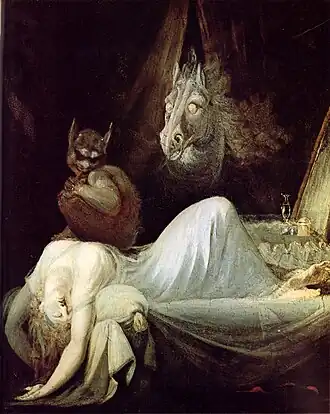 Peinture d'une femme étendue, paraissant évanouie, sur laquelle est assise une créature sombre la couvant d'un regard maléfique. La tête d'un cheval aux yeux exhorbités sort de rideaux en arrière-plan.