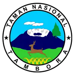 Dessin couleur montrant un volcan bleu sombre avec un grand cratère blanc, un sapin sur son flanc, un cerf bondissant au premier plan dans des herbes vertes et jaunes.