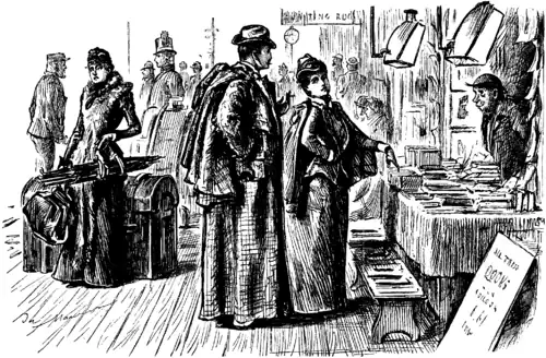 Gravure. Jeunes mariés devant l'étal de livres d'une gare ; la dame pointe du doigt le livre qu'elle convoite.