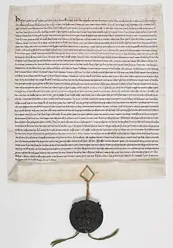 Manuscrit en vieux français, scellé du sceau de Henri&nbsp;III en cire verte sur cordonnets de soie rouge et verte.