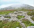 Hillfort Tre'r Ceiri sur les pentes du Yr Eifl. Trois emplacements de maisons de l'âge du fer.
