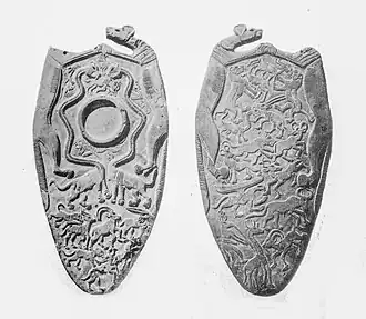 Petite « palette aux lycaons », Nagada&nbsp;III (vers 3300 AEC). Juxtaposition de formes « orchestées », naturalistes et hybrides. Ashmolean Museum, Oxford