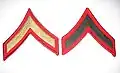 Private first class, insignes de manche.