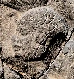 Ouchankhourou, fils de Taharqa, tel que représenté par les Assyriens sur la stèle de la victoire d'Assarhaddon.