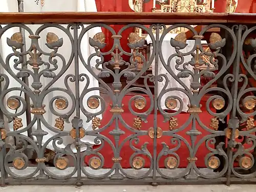 Ouvrage de ferronnerie en l'église Saint-Louis d'Uza, réalisé à la forge d'Uza.