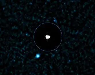 Image VLT de l'exoplanète HD 95086 b(tache bleue) et de son étoile.