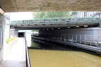 l'Erdre sortant du tunnel Saint Félix en bas, passe sous le pont du quai Malakoff, avant son débouché dans le "Port de l'Erdre" en haut.