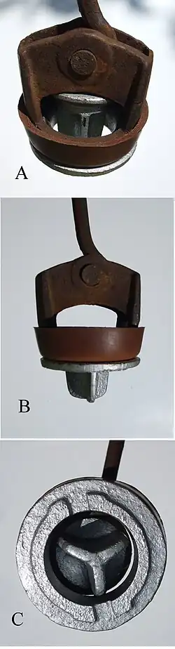 Piston à clapet de pompe aspirante.