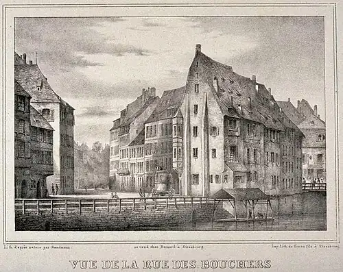 Vue de la rue des Bouchers, lithographie de Franz Josef Sandmann&nbsp;(de) imprimée par Simon.