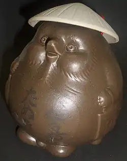 Bouteille de Saké à l’éffigie de Tasaburō.