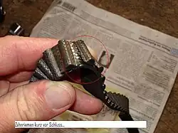 Dent abimée sur une courroie de distribution.